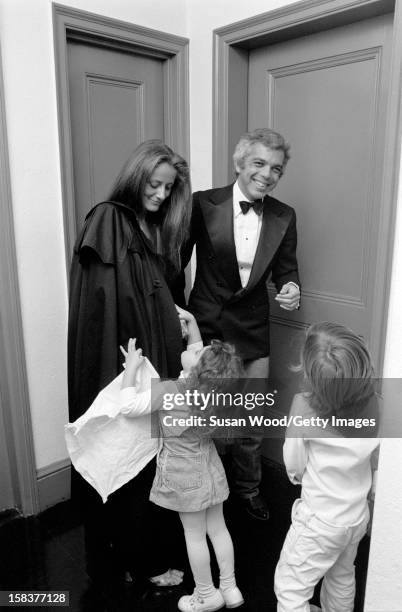 American fashion designer Ralph Lauren and his wife, therapist Ricky Lauren, dressed for a night out, laugh with two of with their three children ,...