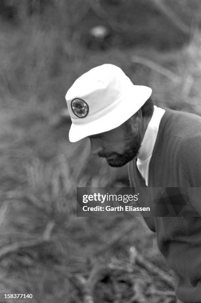 During the Bing Crosby National Pro-Amateur golf tournament, American actor James Garner looks for his ball in the rough on the course near the 17th...