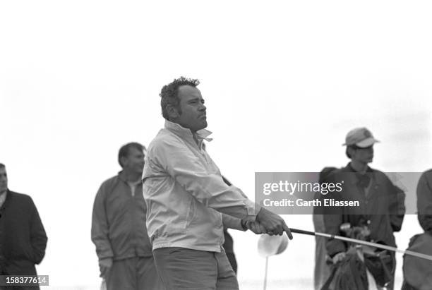 During the Bing Crosby National Pro-Amateur golf tournament, American actor Jack Lemmon watches his shot on the course near the 17th hole at Cypress...