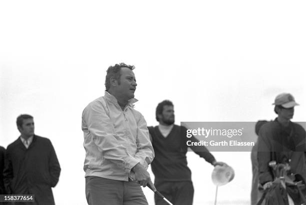 During the Bing Crosby National Pro-Amateur golf tournament, American actor Jack Lemmon watches his shot on the course near the 17th hole at Cypress...