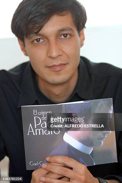 Mexican film director Carlos Carrera discusses his new motion picture, "El Crimen del Padre Amaro" during an interview with AFP 09 August 2002 in...