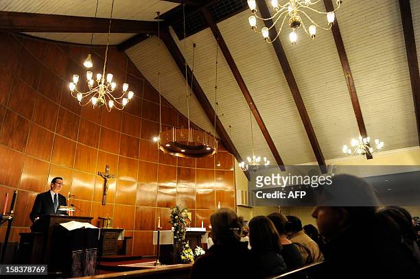 Dannel Malloy, Governor of Connecticut, during a moment of silence inside the St. Rose of Lima Roman Catholic Church at a vigil service for victims...