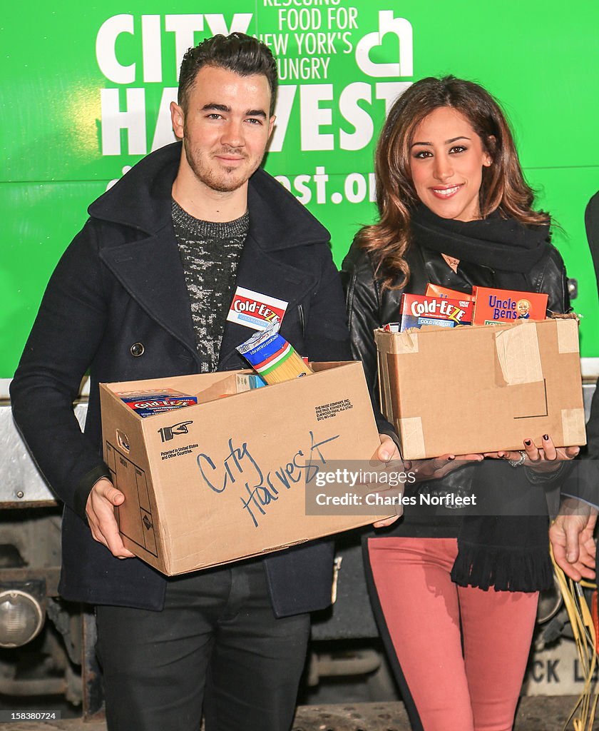Kevin Jonas And Danielle Jonas And City Harvest Holiday Season Food Drive