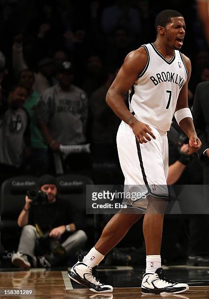Joe Johnson of the Brooklyn Nets celebrates his game winning basket over the Detroit Pistons on December 14, 2012 at the Barclays Center in the...