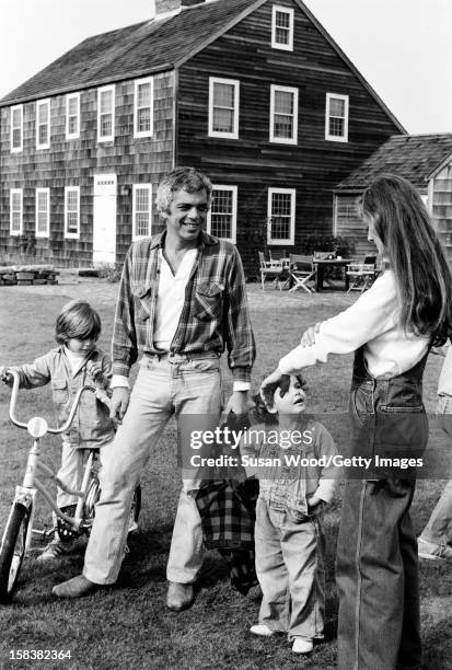 American fashion designer Ralph Lauren and his wife, therapist Ricky Lauren, outside their home, with two of their three children , East Hampton, New...