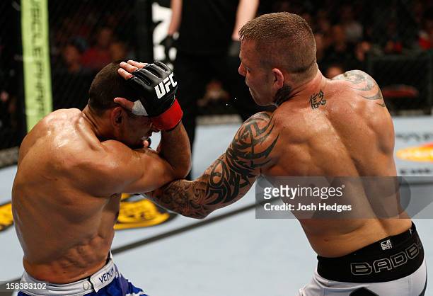 Ross Pearson punches George Sotiropoulos during their lightweight fight at the UFC on FX event on December 15, 2012 at Gold Coast Convention and...