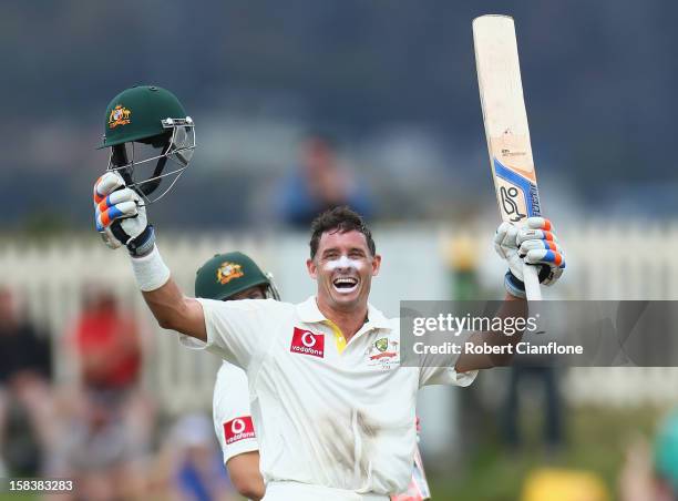 Michael Hussey of Australia celebrates after he scoring his century during day two of the First Test match between Australia and Sri Lanka at...
