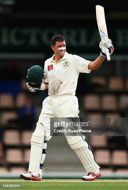 Michael Hussey of Australia celebrates after reaching his century during day two of the First Test match between Australia and Sri Lanka at...