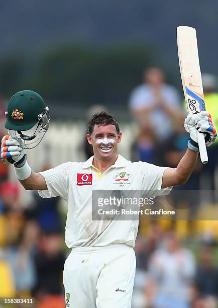 Michael Hussey of Australia celebrates after he scoring his century during day two of the First Test match between Australia and Sri Lanka at...