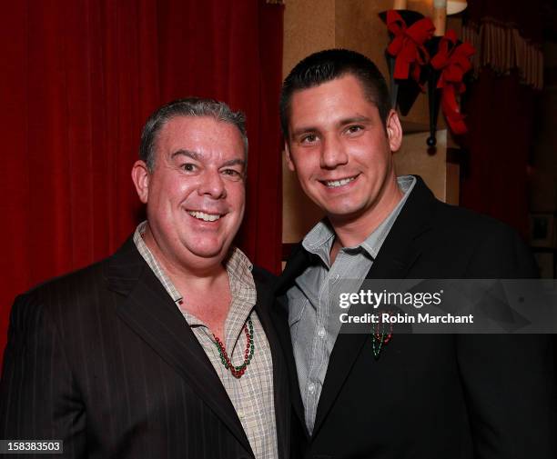 Elvis Duran and Alex Carr attend Elvis Duran Morning Show Holiday Party at Carmine's on December 14, 2012 in New York City.