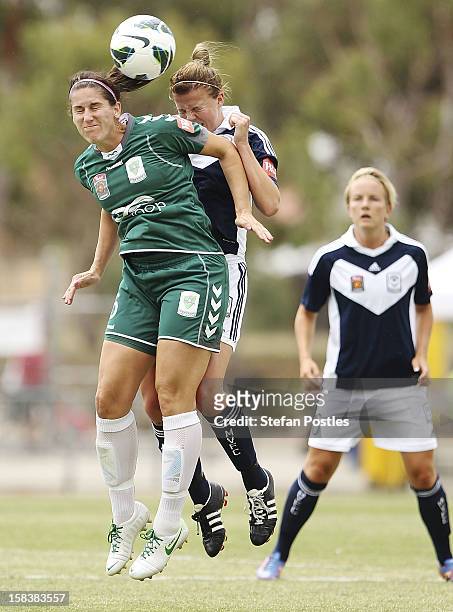 Caitlin Munoz of Canberra United and Amy Jackson of Melbourne Victory contest possession during the round nine W-League match between Canberra United...