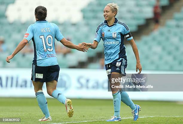 Kyah Simon celebrates with teammate Emma Kete after scoring during the round nine W-League match between Sydney FC and Perth Glory at Allianz Stadium...