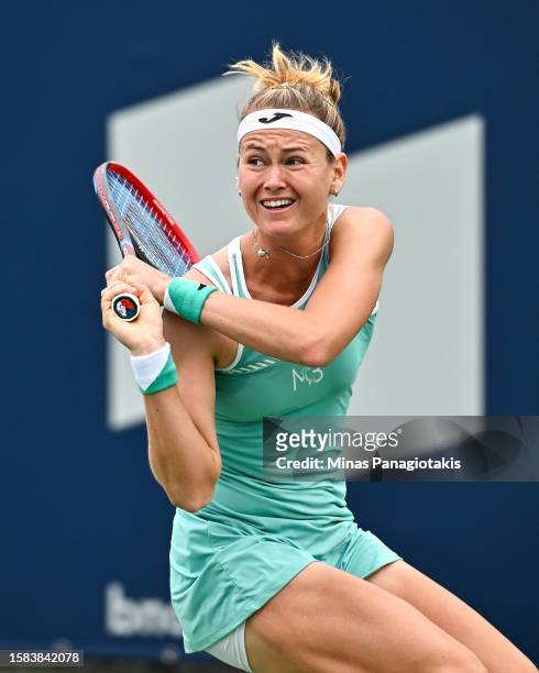 Marie Bouzkova of the Czech Republic hits a return against Kayla Day of the United States of America on Day 1 during the National Bank Open at Stade...