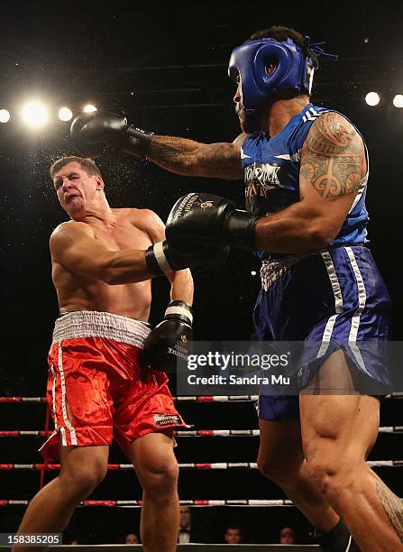 Rene Ranger punches Greg Bird during the bout between Greg Bird and Rene Ranger during the 2012 Fight for Life at Trusts Stadium on December 15, 2012...