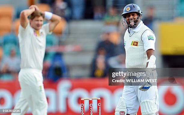 Sri Lanka's batsman Thilan Samaraweera reacts after nearly being dismissed by Australia's bowler Shane Watson on the second day of the first cricket...