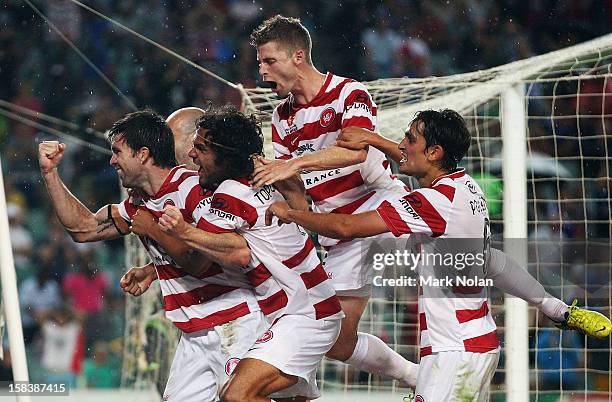 Michael Beauchamp of the Wanderers celebrates scoring a goal with team mates during the round 11 A-League match between Sydney FC and the Western...