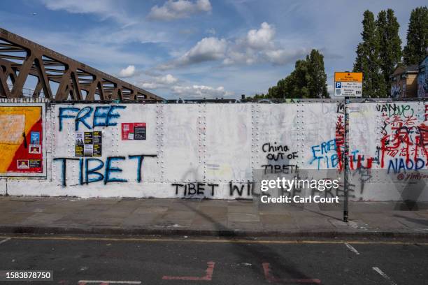 Pro-democracy messages are written on an area of wall that had been graffitied with Chinese Communist Party ideology, on August 7, 2023 in Brick...