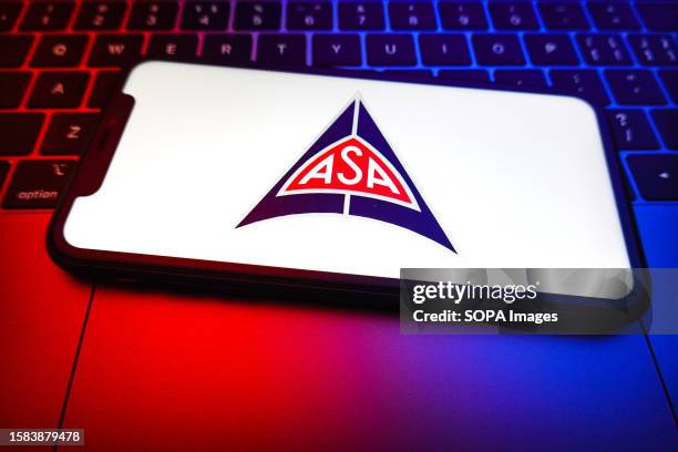 In this photo illustration, the ASA logo is displayed on the screen of a smartphone. ASA was an Italian car manufacturer active from 1961 to 1969....