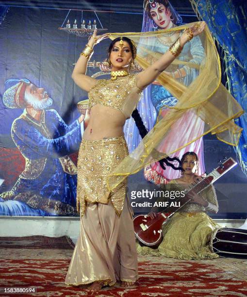 Pakistani film actress Sana dances during the shooting of the film 'Dako Hasina' in Lahore, 16 January 2005. Pakistan's film industry known as...