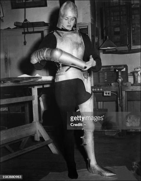 Swedish actress Ingrid Bergman trys the armor that she will wear for her role of Joan of Arc, a movie directed by Victor Fleming, 09 October 1947....