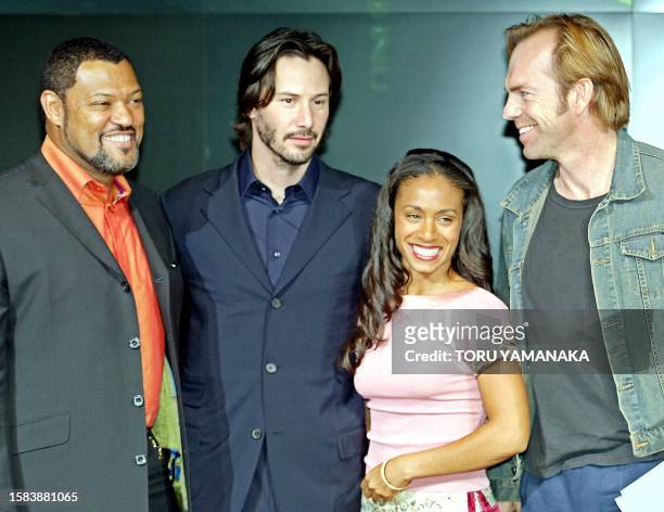 American movie star Keanu Reeves shares a light moment with his co-actors Laurence Fishburne , Jada Pinkett Smith and Hugo Weaving of Australia...