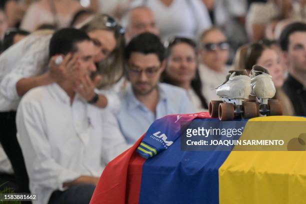 Relatives mourn during the funeral of Colombian former skater Luz Mery Tristan at the Luz Mery Tristan sports center in Pance, near Cali, Valle del...