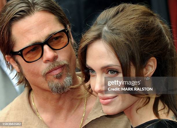 Actors Brad Pitt and Angelina Jolie arrive on the red carpet for the Los Angeles premiere Of DreamWorks Animation's "Kung Fu Panda 2" at Grauman's...