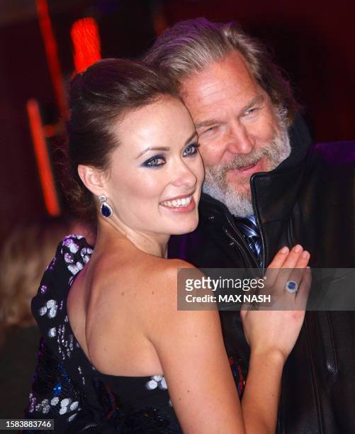 Actors Jeff Bridges and Olivia Wilde joke as they arrive for British Premiere of their latest film 'Tron' by US director Steven Lisberger in London's...