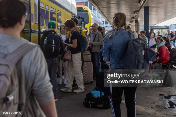 Passengers wait to board a bus to Minsk, Belarus, at Warsaw West bus station on July 21, 2023. Strongman Alexander Lukashenko violently put down...