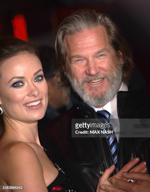 Actors Jeff Bridges and Olivia Wilde joke as they arrive for British Premiere of their latest film 'Tron' by US director Steven Lisberger in London's...