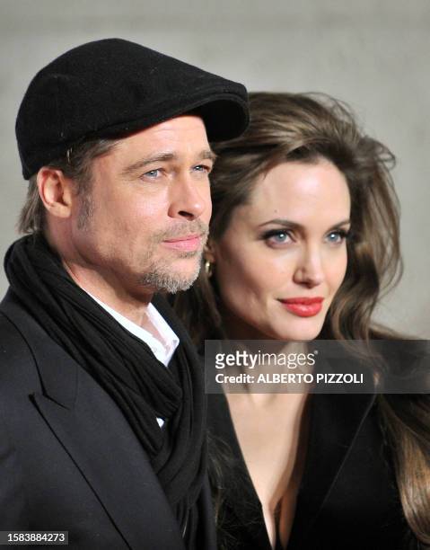 Actors Brad Pitt and Angelina Jolie pose upon arrival for the premiere of Jolie's latest movie ''The Tourist'' by German director Florian Henckel von...