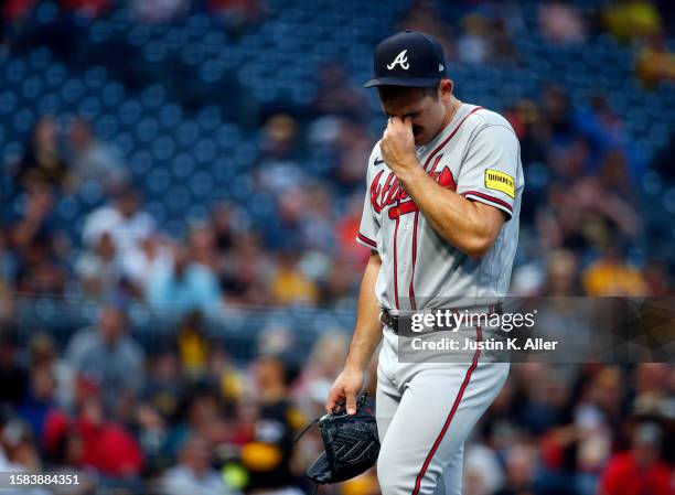 Spencer Strider of the Atlanta Braves reacts in the third inning after being pulled after giving up 6 runs on 5 hits against the Pittsburgh Pirates...