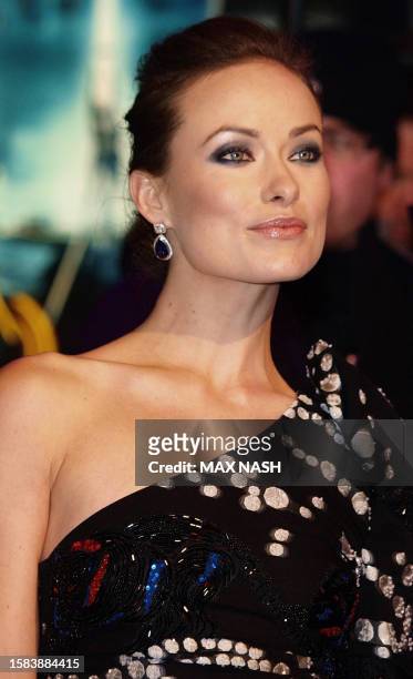 Actress Olivia Wilde poses for photographers as she arrives for the British Premiere of her latest film 'TRON: Legacy' a sequel to the 1982 Disney...