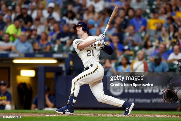 Milwaukee Brewers designated hitter Mark Canha hits a foul ball in the fourth inning during a regular season game between the Colorado Rockies and...