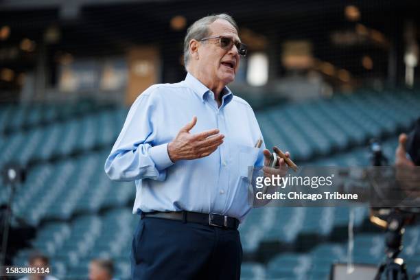 Chairman Jerry Reinsdorf smokes a cigar during warmups before the White Sox play the Yankees at Guaranteed Rate Field on Monday, Aug. 7, 2023.