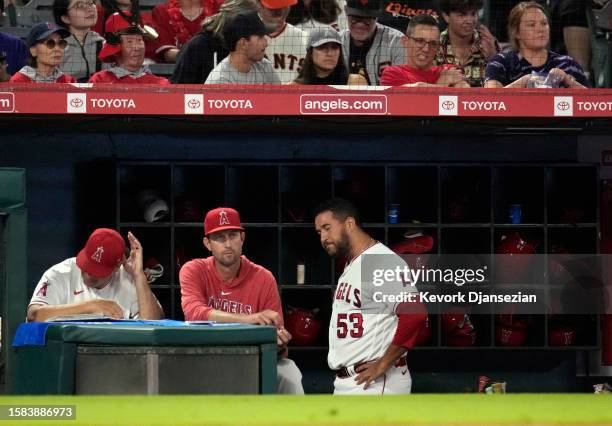 Closer Carlos Estevez of the Los Angeles Angels reacts in the dugout against the San Francisco Giants during the ninth inning at Angel Stadium of...