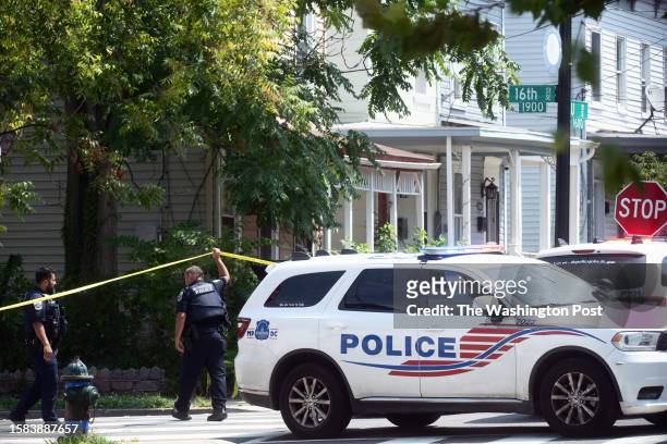 Police patrol and continue to investigate where three people were shot and killed in an outbreak of gunfire in the Anacostia area of Southeast...