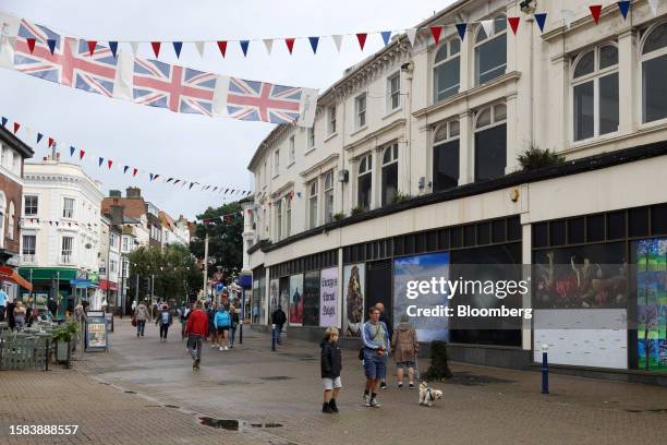 Pedestrians pass the closed down Debenhams department store on the high street in Eastbourne, UK, on Saturday, Aug. 5, 2023. A jobs boom in Britain's...