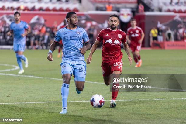 Tayvon Gray of NYCFC and Lucas Lima Linhares known as Luquinhas of Red Bulls chase the ball during the round of 32 League Cup 2023 match between York...