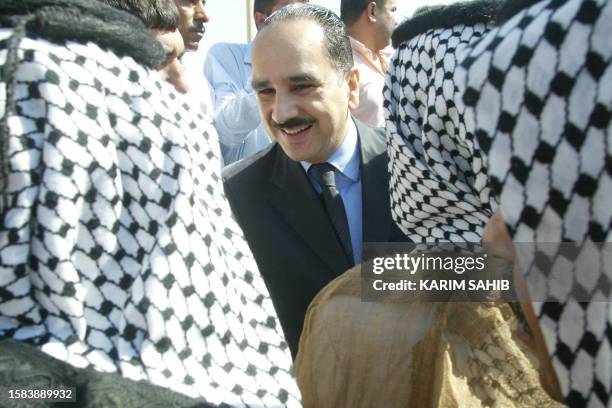 Al-Sharif Ali bin al-Hussein , the son of a cousin of former Iraqi King Ghazi and pretender to the Iraqi throne, greets supporters during his visit...