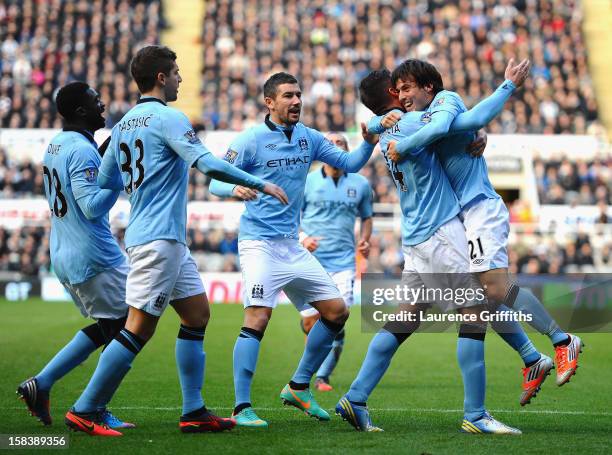 Javi Garcia and David Silva of Manchester City celebrate the second goal during the Barclays Premier League match between Newcastle United and...