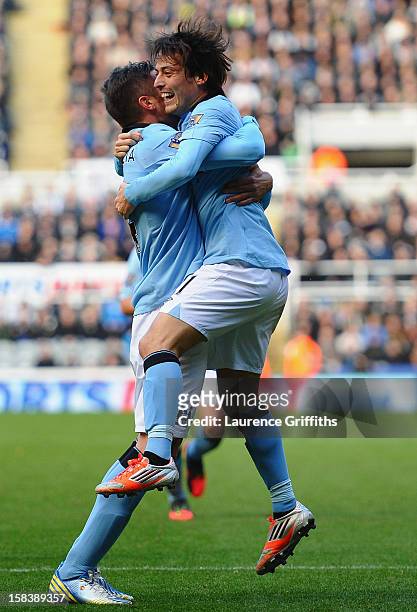 Javi Garcia and David Silva of Manchester City celebrate the second goal during the Barclays Premier League match between Newcastle United and...