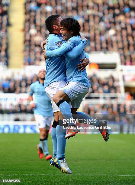 Javi Garcia and David Silva of Manchester City celebrate the second goal during the Barclays Premier League match between Newcastle United and...