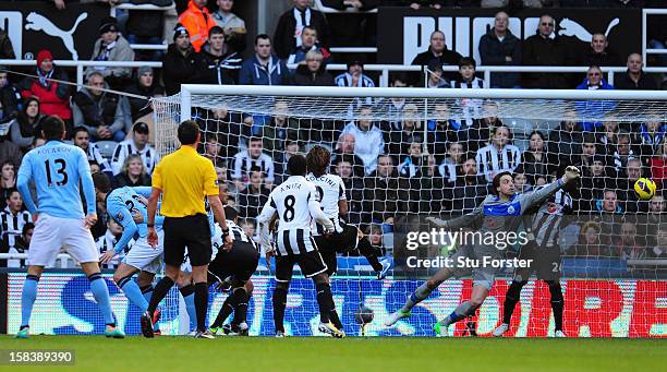 Manchester City player Javi Garcia heads in the second City goal past Tim Krul during the Barclays Premier League match between Newcastle United and...