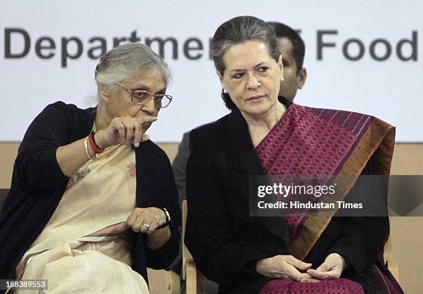 Chairperson Sonia Gandhi and Delhi Chief Minister Sheila Dikshit during the launch of the Delhi Annshree Yojana on December 15, 2012 in New Delhi,...