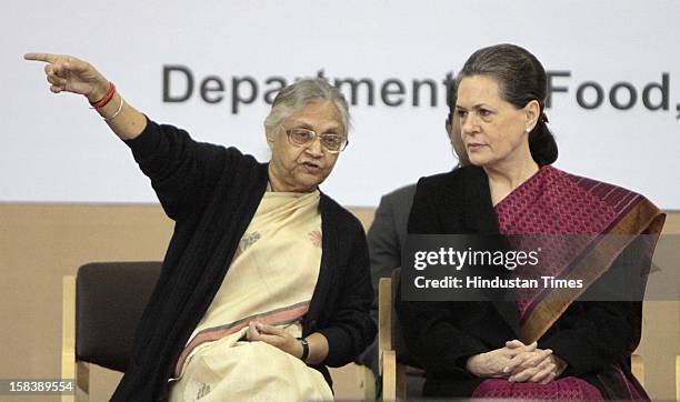 Chairperson Sonia Gandhi and Delhi Chief Minister Sheila Dikshit during the launch of the Delhi Annshree Yojana on December 15, 2012 in New Delhi,...