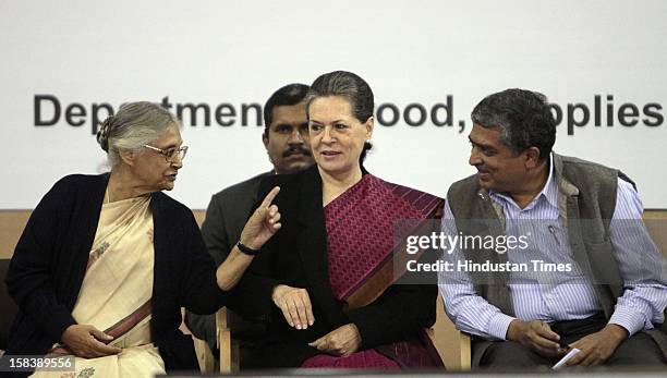 Chairperson Sonia Gandhi, Delhi Chief Minister Sheila Dikshit and UIDAI Chairman Nandan Nilekani during the launch of the Delhi Annshree Yojana on...