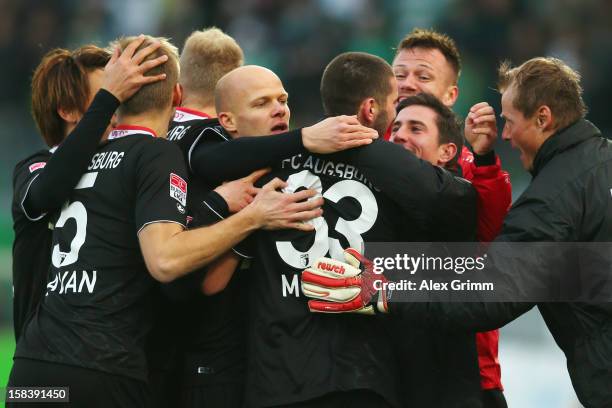 Sascha Moelders of Augsburg celebrates his team's first goal with team mates during the Bundesliga match between SpVgg Greuther Fuerth and FC...