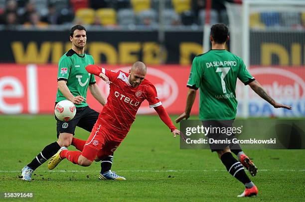 Mario Eggimann of Hannover challenges Dani Schahin of Duesseldorf during the Bundesliga match between Fortuna Duesseldorf 1895 and Hannover 96 at...