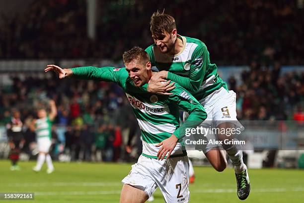 Lasse Sobiech of Greuther Fuerth celebrates his team's first goal with team mate Christopher Noethe during the Bundesliga match between SpVgg...